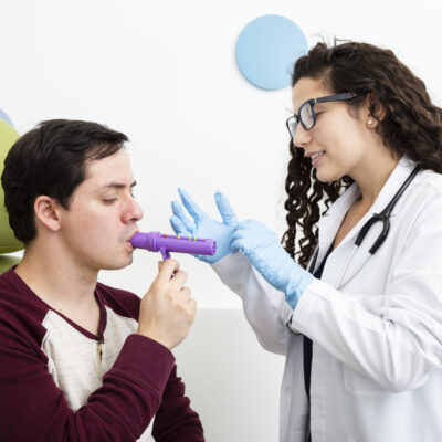 side-view-patient-using-peak-flow-meter side-view-patient-using-peak-flow-meter