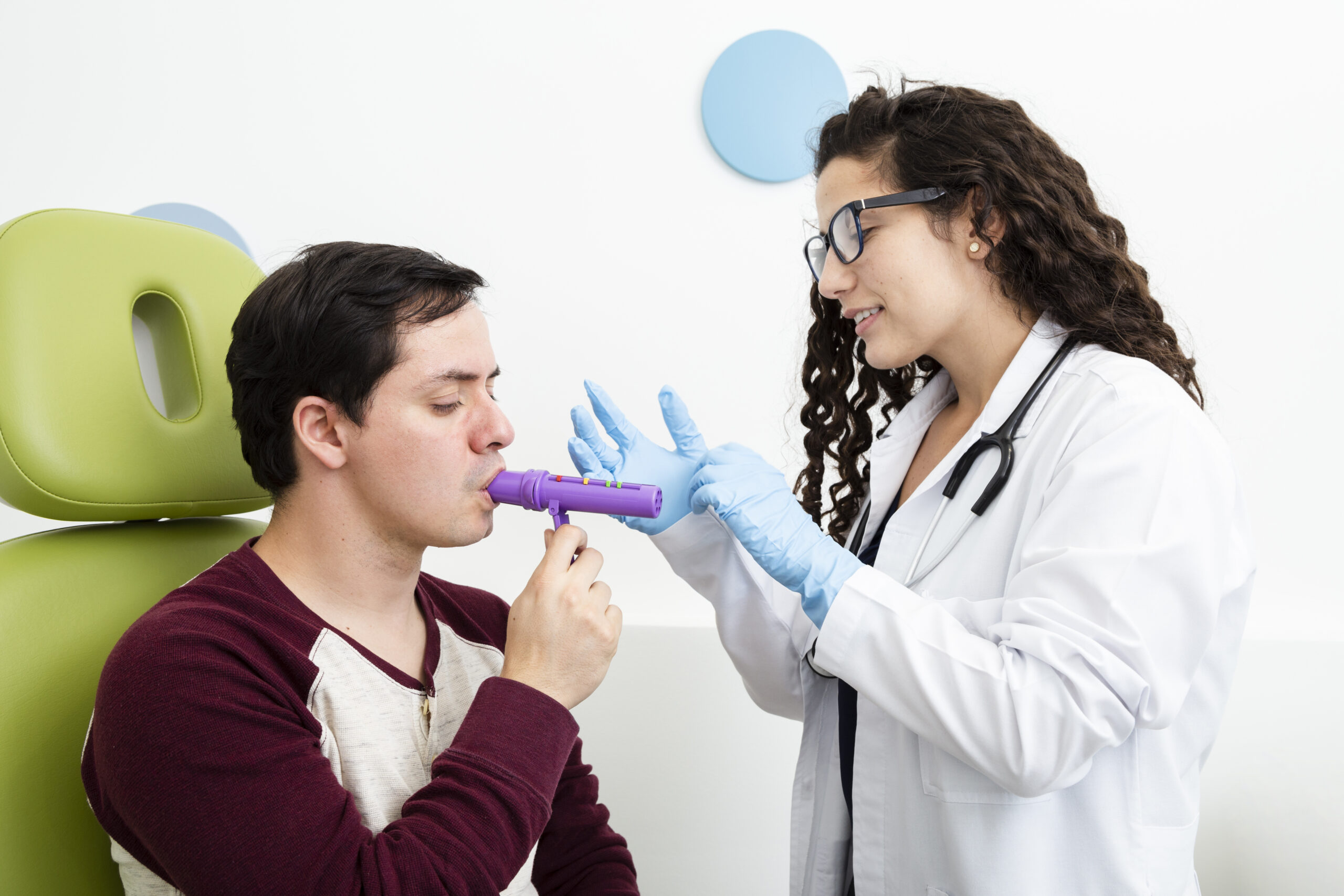 side-view-patient-using-peak-flow-meter