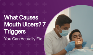 Dentist examining inside of patient's cheek for mouth ulcers during routine check-up